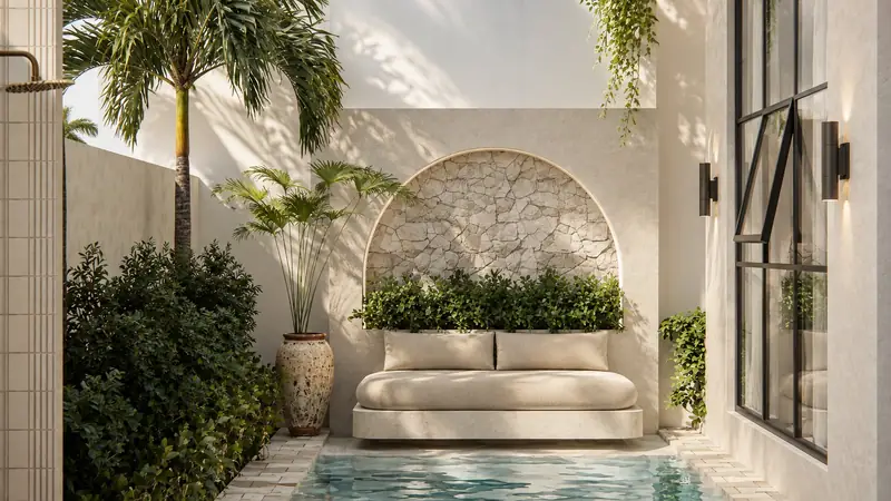 Bali Villa pool with sunbed beneath a lit arch