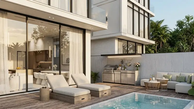Prime Villa poolside terrace with loungers and outdoor kitchen